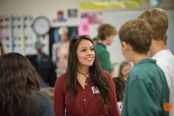 Female student with class image